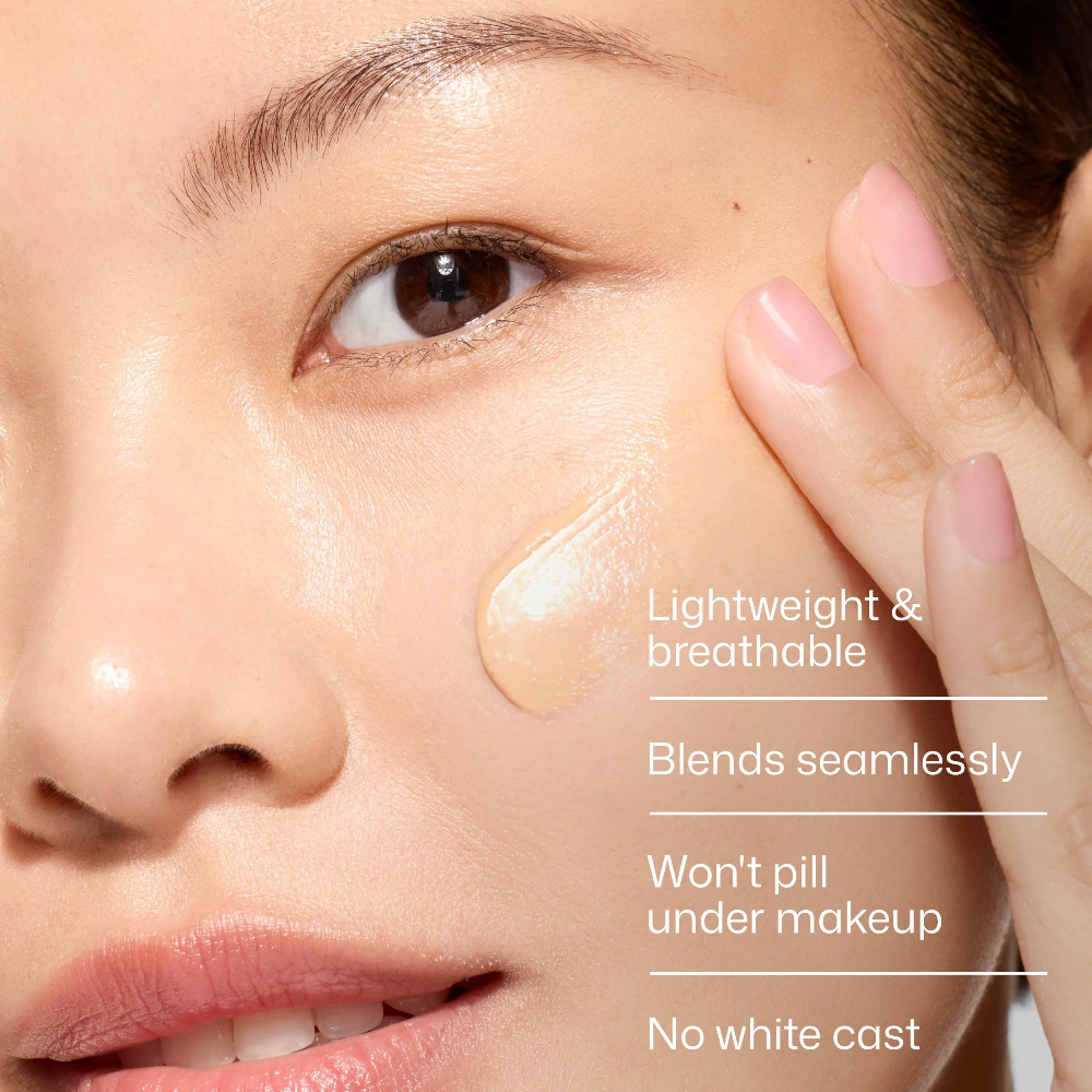 EltaMD UV Daily Facial Sunscreen Tinted Broad-Spectrum SPF 40 1.7 oz / 48 g swatch on cheek with “Blends seamlessly” and “No white cast” text