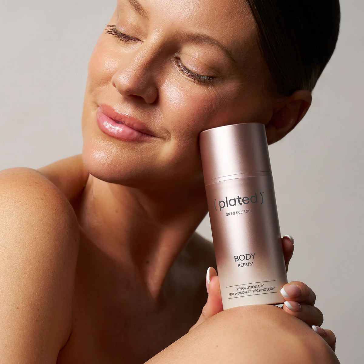 ( plated )™ Skin Science BODY Serum woman holding 