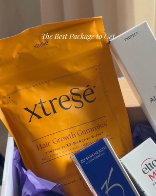 Opened RegimenPro unboxing with Xtrese Hair Growth Gummies, ZO Skin Health products and purple tissue paper.