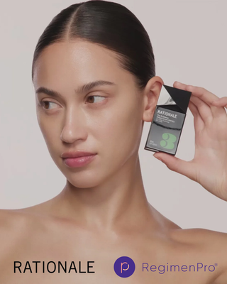Person holding a RATIONALE skincare product next to their face, with the RATIONALE and RegimenPro logos.