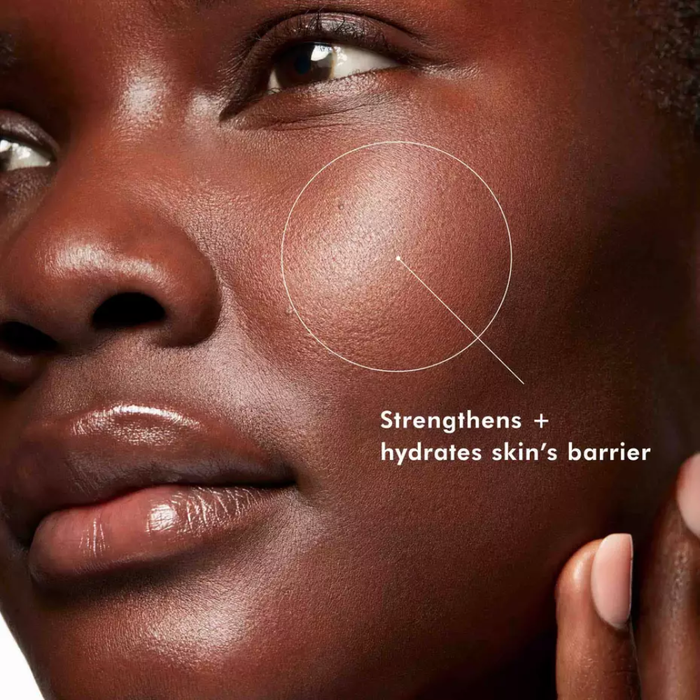 SkinCeuticals Phyto Corrective Essence Mist, 50ml: close-up of a model's cheek with a callout reading "Strengthens + hydrates skin's barrier"