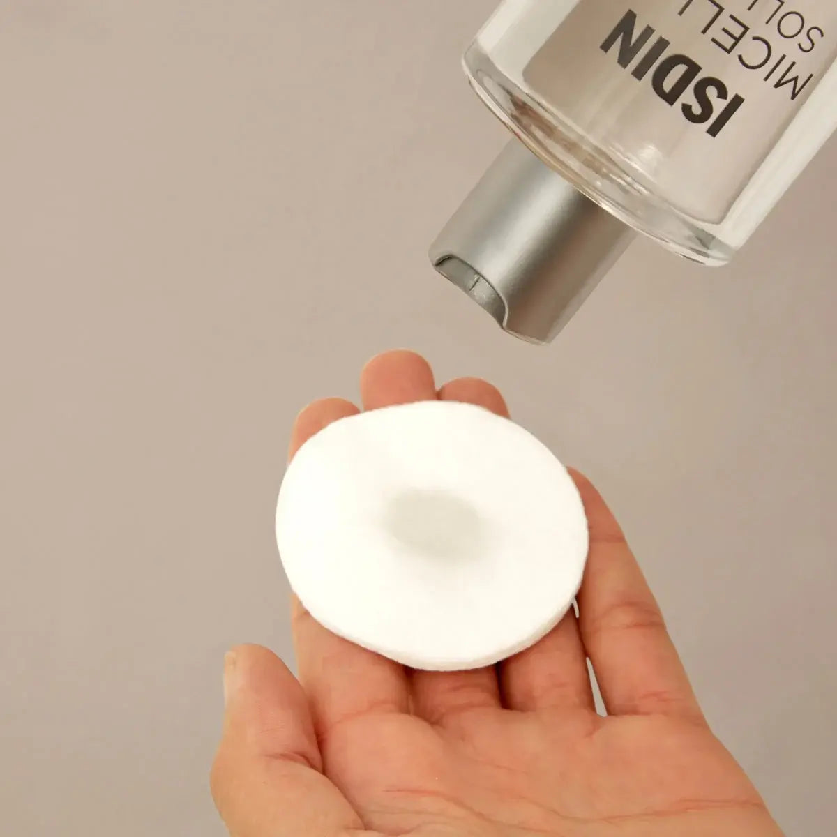 ISDIN Micellar Solution 4-in-1 product on pad