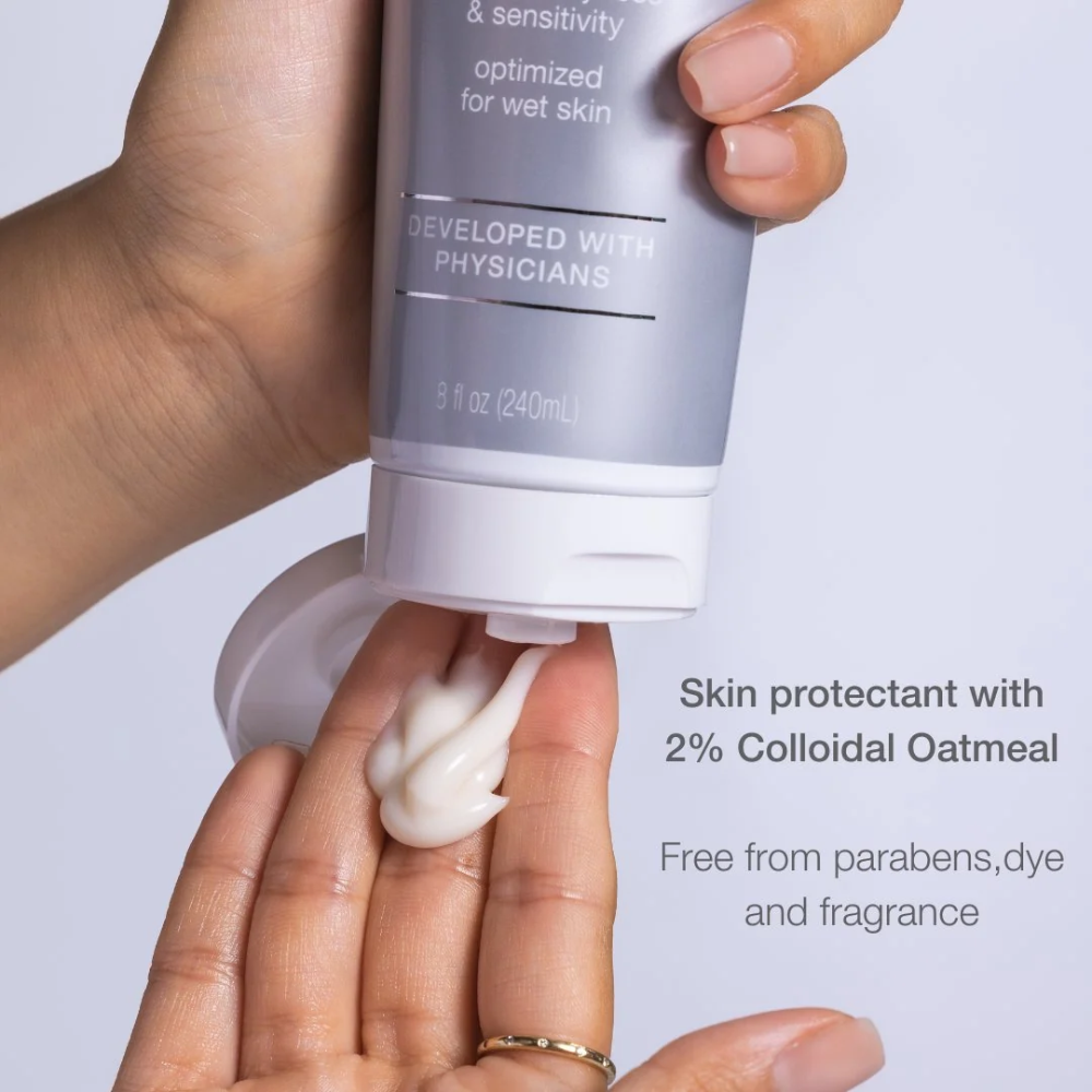 CLn Body Moisturizer 8 fl. oz. cream squeezed onto fingers - skin protectant with 2% colloidal oatmeal, free from parabens, dye and fragrance