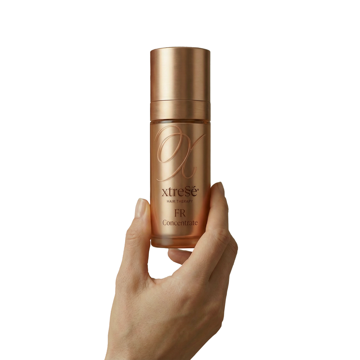 Xtressé FR Concentrate bottle in model hand